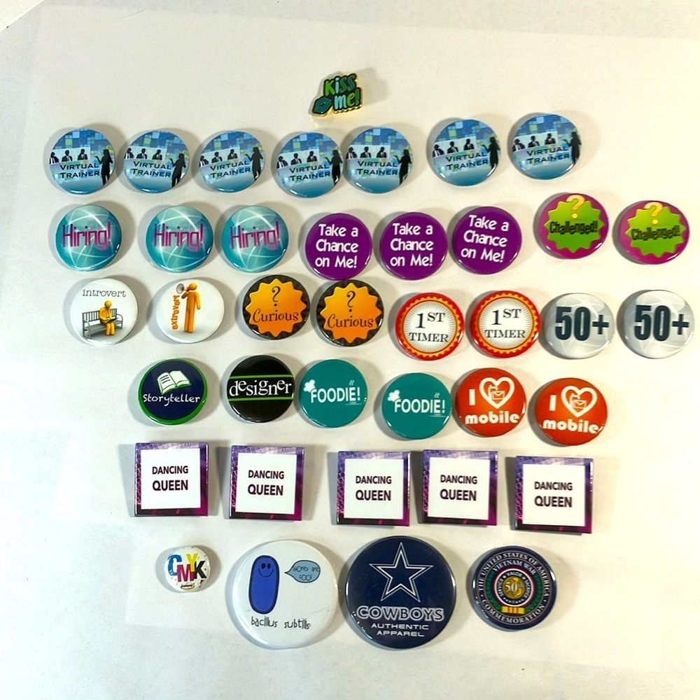 39 various pin-on buttons pins